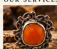 Ornate ring with a vivid orange natural stone